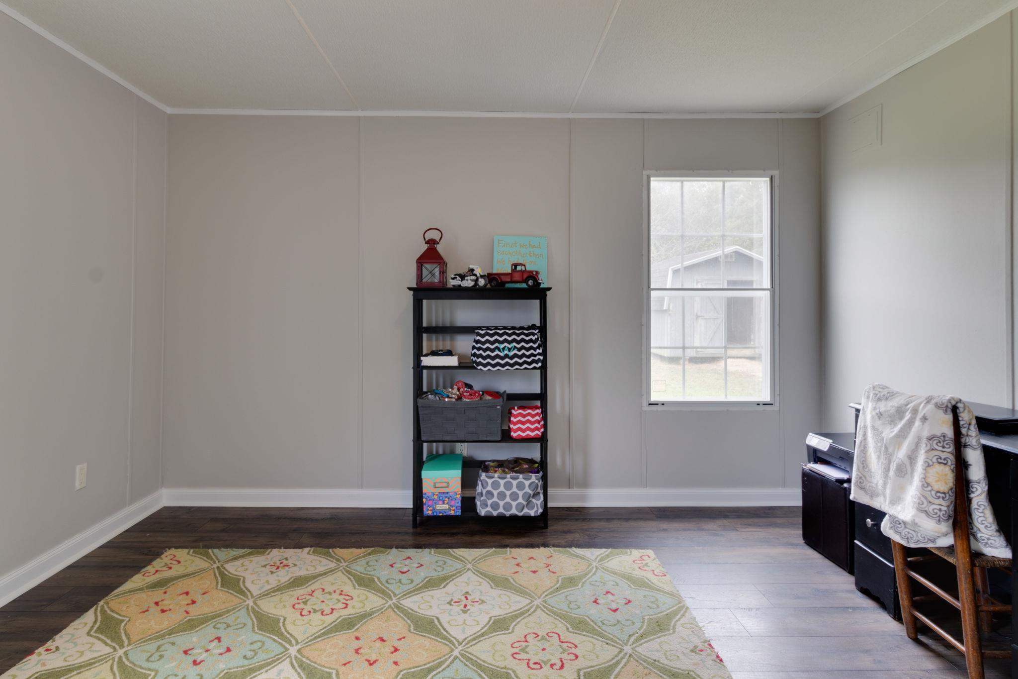 3245 Les Chappell Road Spring Hill, TN 37174 - Photo 16 of 22 a bedroom with furniture and a window