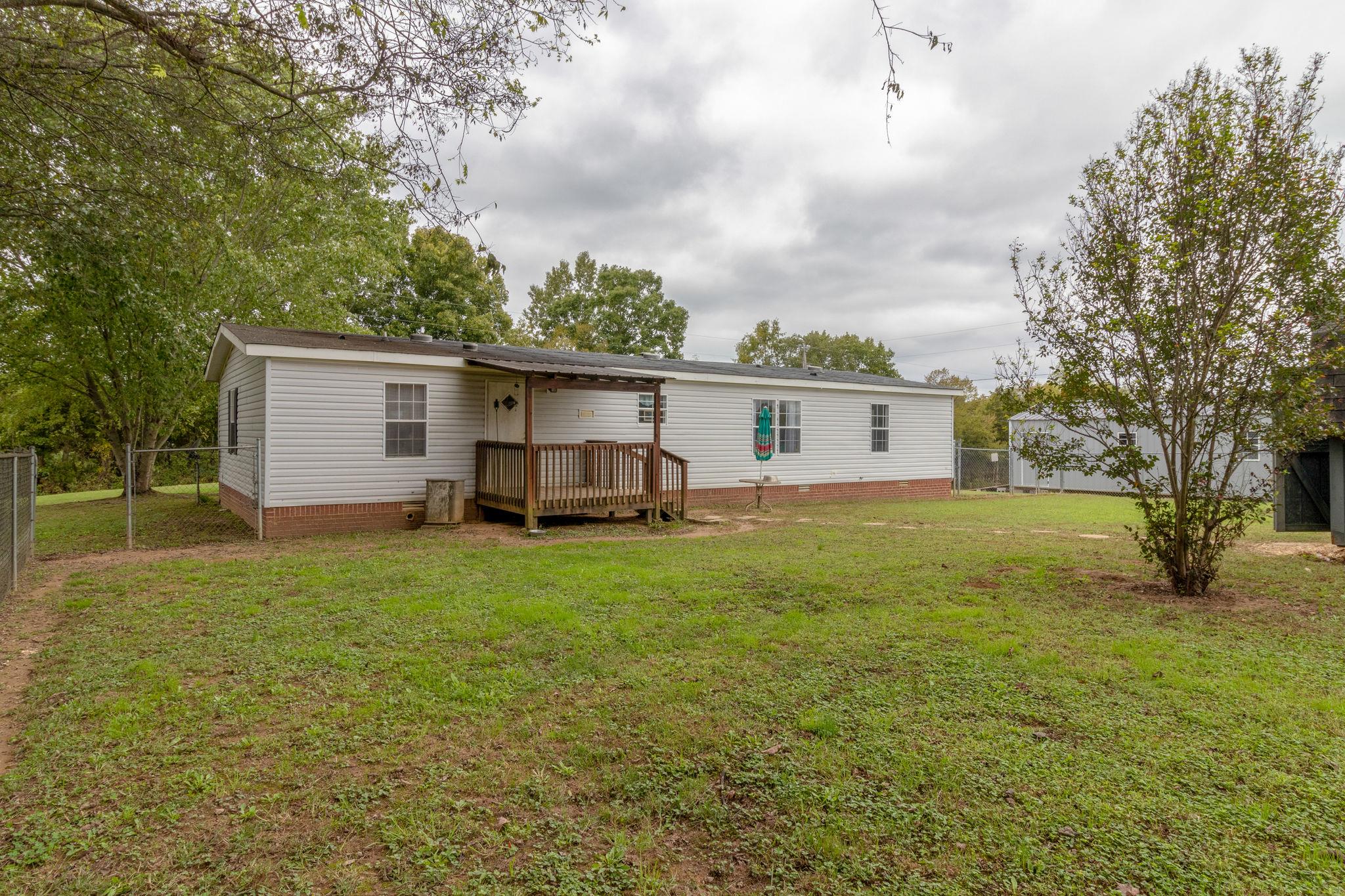 3245 Les Chappell Road Spring Hill, TN 37174 - Photo 19 of 22 a view of a house with backyard and trees