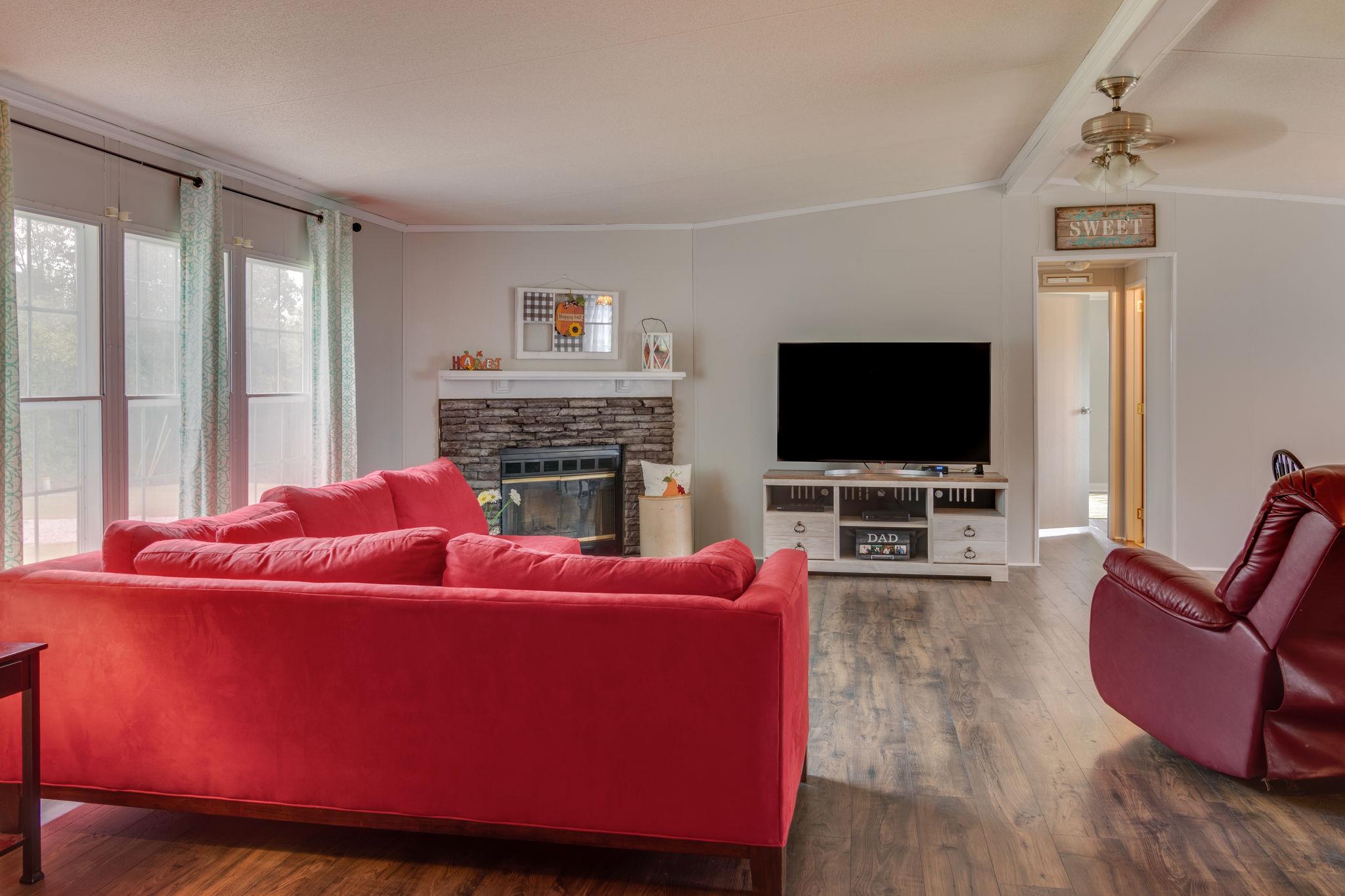 3245 Les Chappell Road Spring Hill, TN 37174 - Photo 3 of 22 a living room with furniture and a flat screen tv