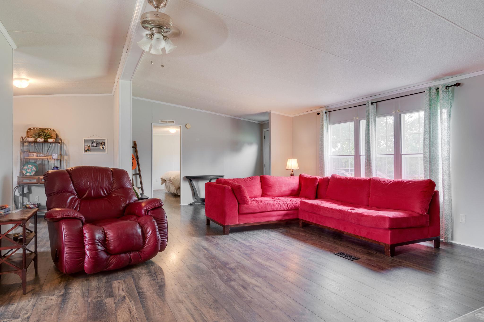 3245 Les Chappell Road Spring Hill, TN 37174 - Photo 4 of 22 a living room with furniture and wooden floor