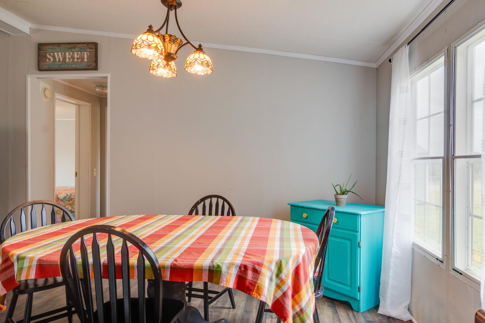 3245 Les Chappell Road Spring Hill, TN 37174 - Photo 5 of 22 a bedroom with a bed and a chandelier