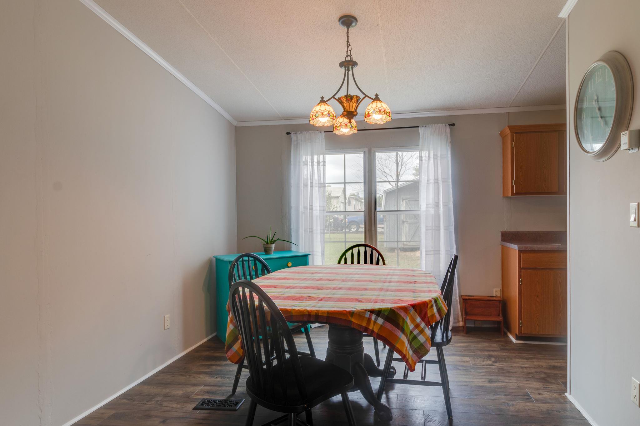 3245 Les Chappell Road Spring Hill, TN 37174 - Photo 6 of 22 a view of a dining room with furniture window and wooden floor