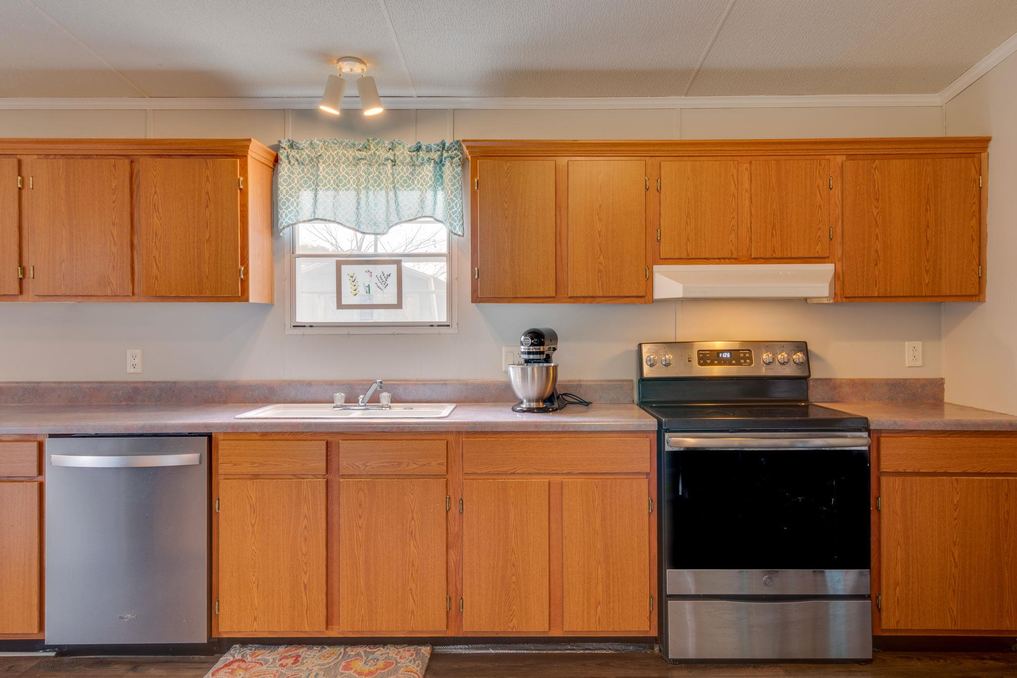 3245 Les Chappell Road Spring Hill, TN 37174 - Photo 7 of 22 a kitchen with a stove and a sink