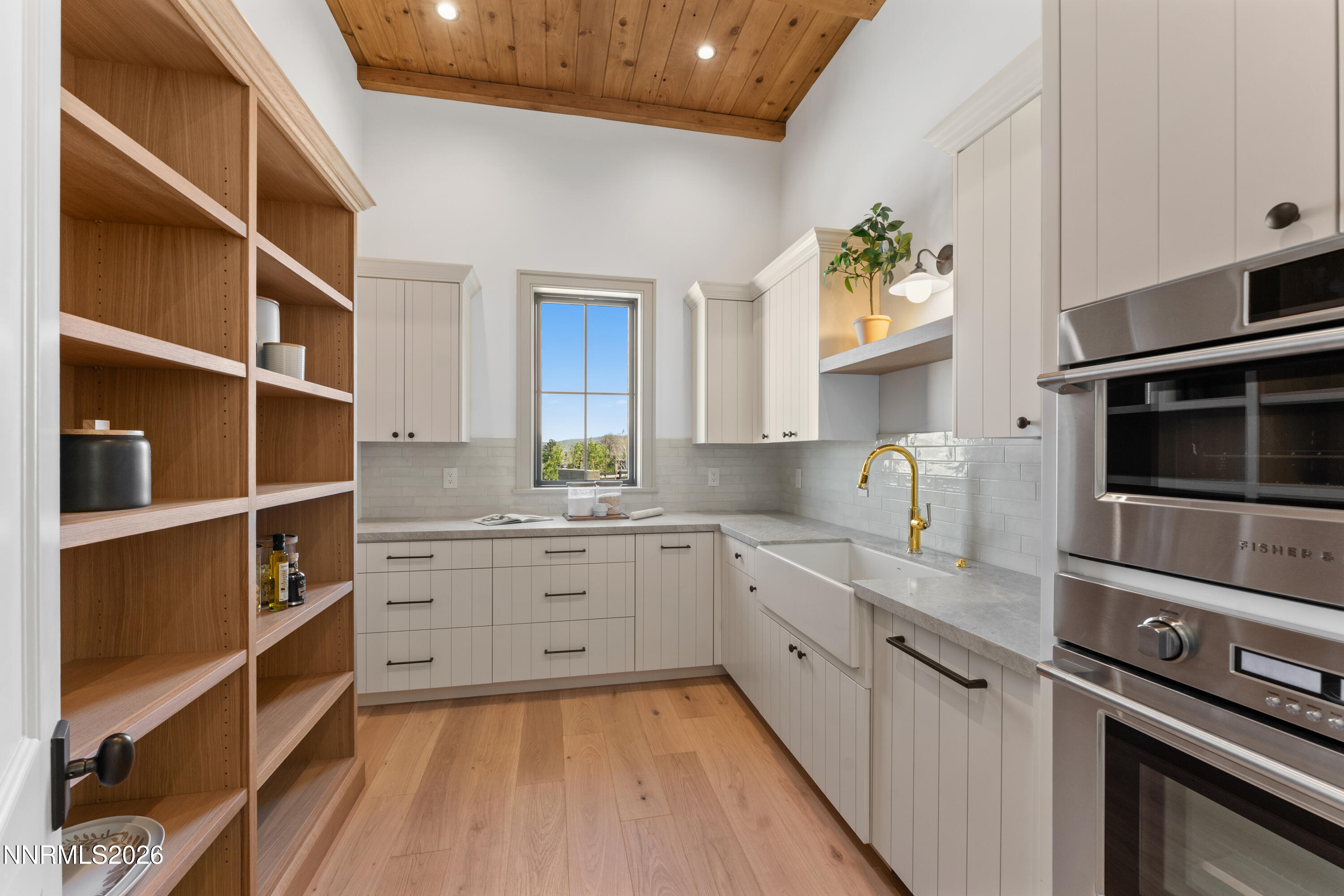 11 Glenhaven Drive Reno, NV 89511 - Photo 12 of 51 a kitchen with a sink stainless steel appliances and cabinets