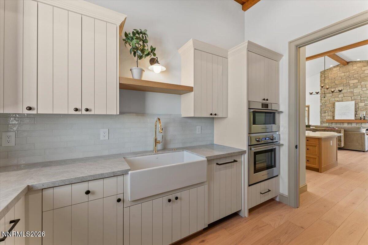 11 Glenhaven Drive Reno, NV 89511 - Photo 13 of 51 a kitchen with stainless steel appliances white cabinets and a sink