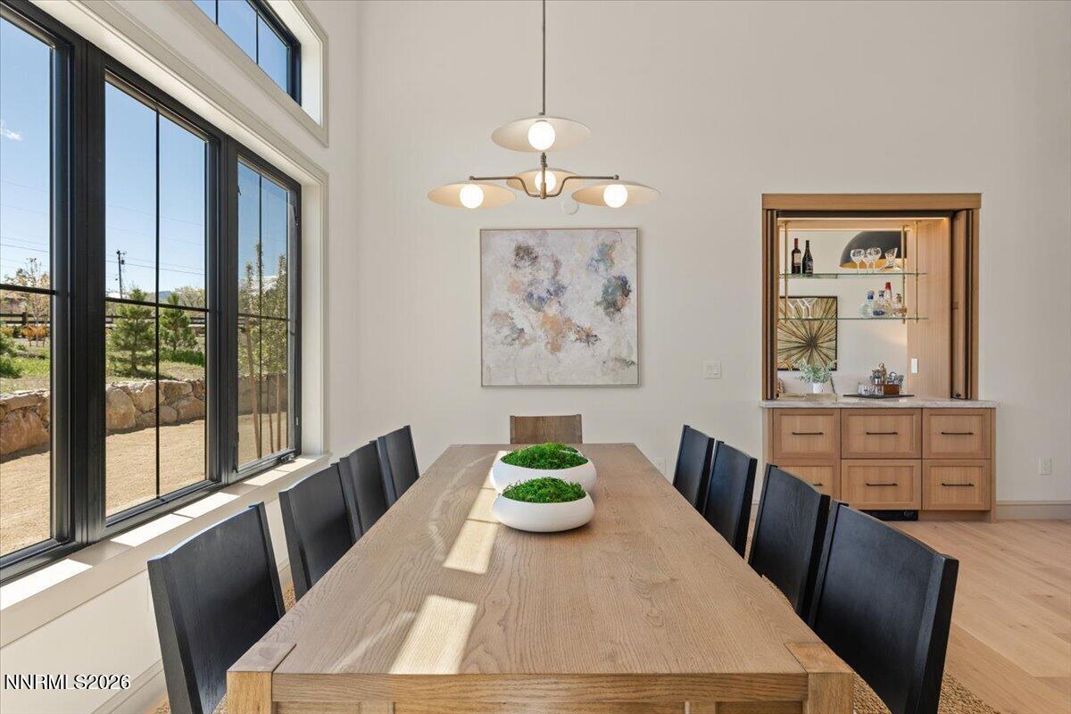 11 Glenhaven Drive Reno, NV 89511 - Photo 15 of 51 a view of a dining room with furniture window and wooden floor
