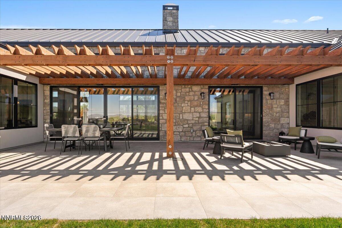11 Glenhaven Drive Reno, NV 89511 - Photo 21 of 51 a patio with table and chairs