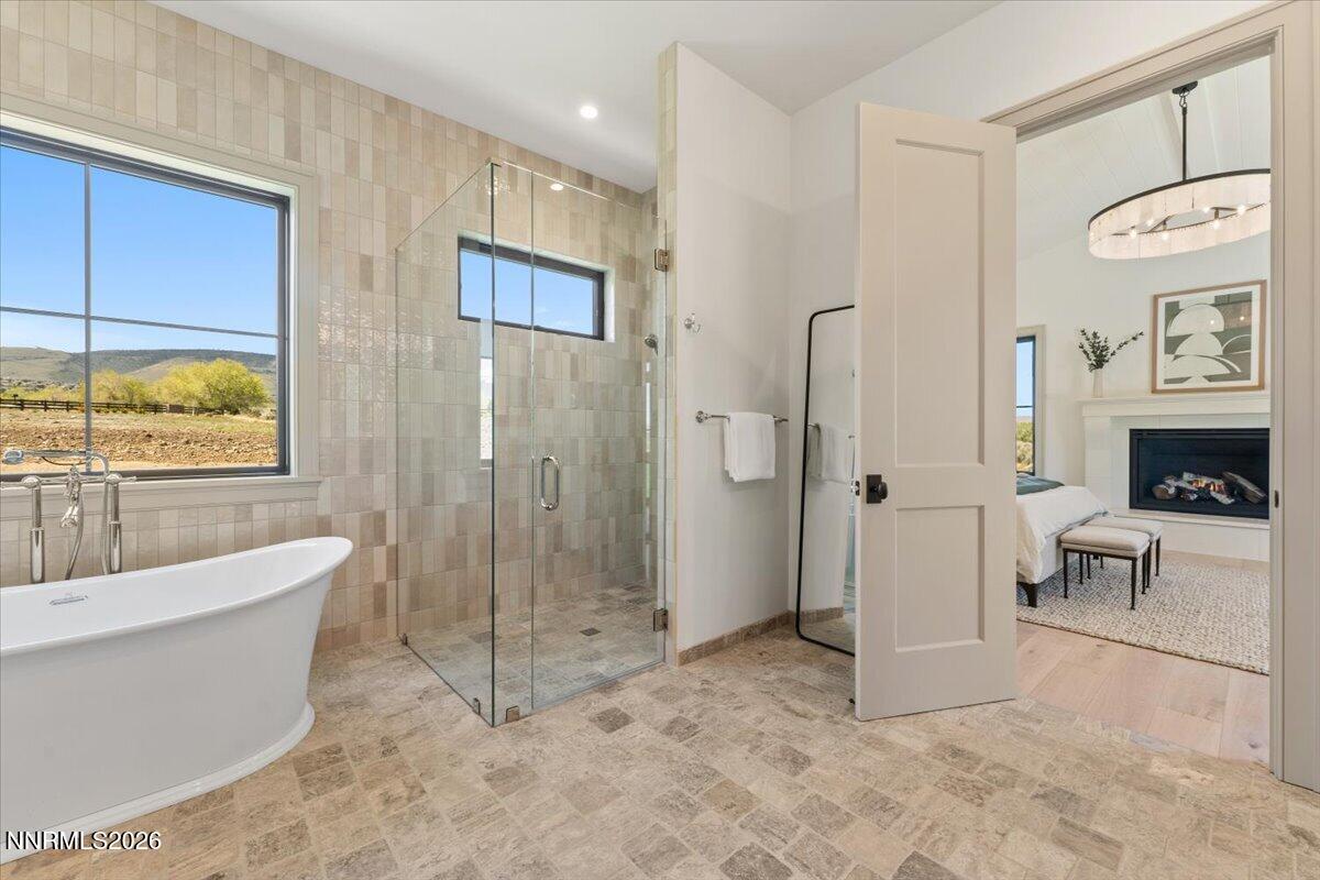 11 Glenhaven Drive Reno, NV 89511 - Photo 25 of 51 a spacious bathroom with a bathtub and a shower