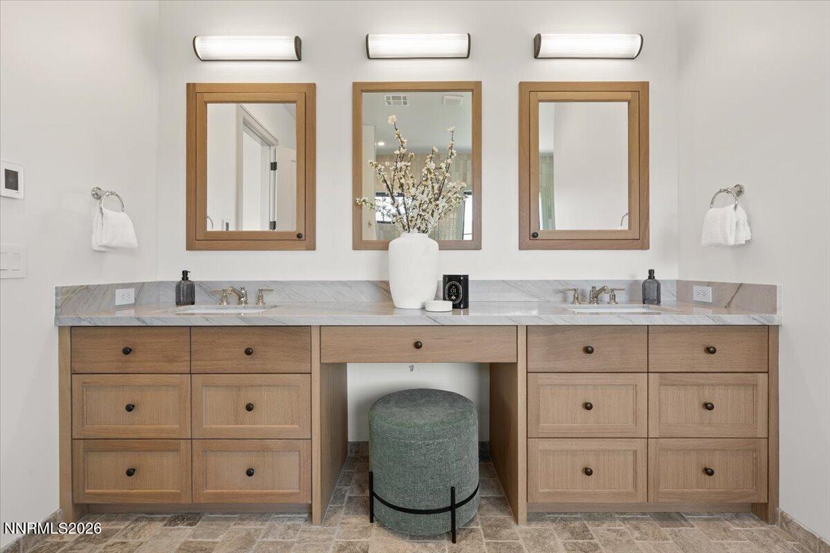 11 Glenhaven Drive Reno, NV 89511 - Photo 27 of 51 a bathroom with a granite countertop double vanity sink mirror and window