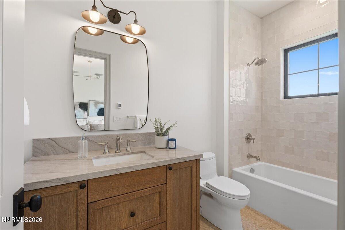 11 Glenhaven Drive Reno, NV 89511 - Photo 34 of 51 a bathroom with a sink a toilet and shower