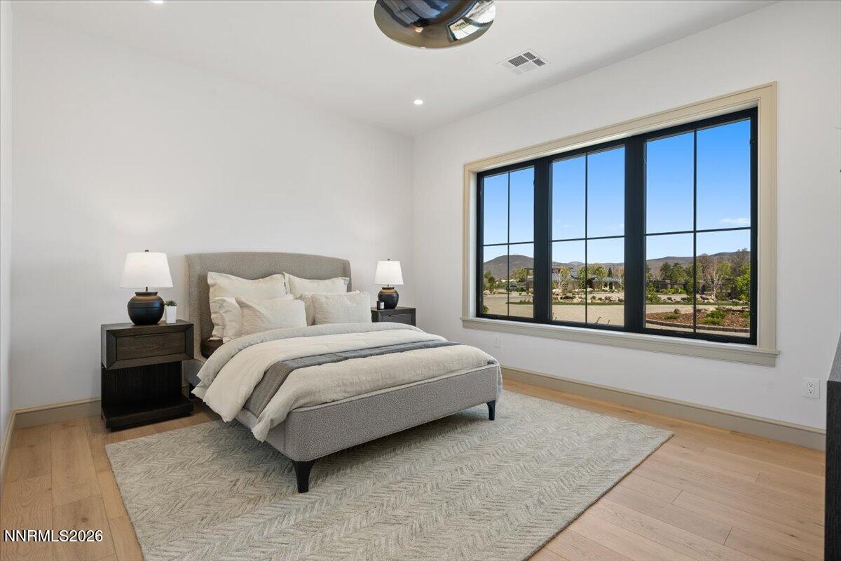 11 Glenhaven Drive Reno, NV 89511 - Photo 41 of 51 a spacious bedroom with a large bed and a large window