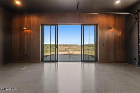 a kitchen with cabinets appliances a sink and a window