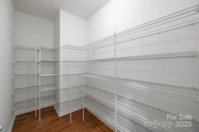 a view of a room with a white walls