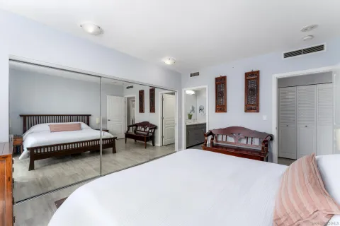 a bedroom with a bed and a couch