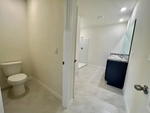 a bathroom with a toilet and a sink