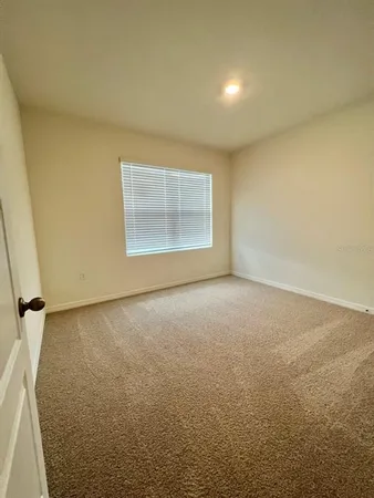 an empty room with a empty space and window