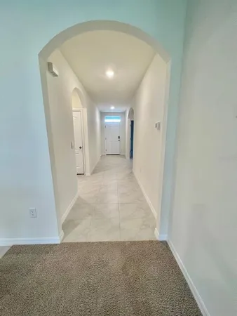 a view of a big room with closet and mirror