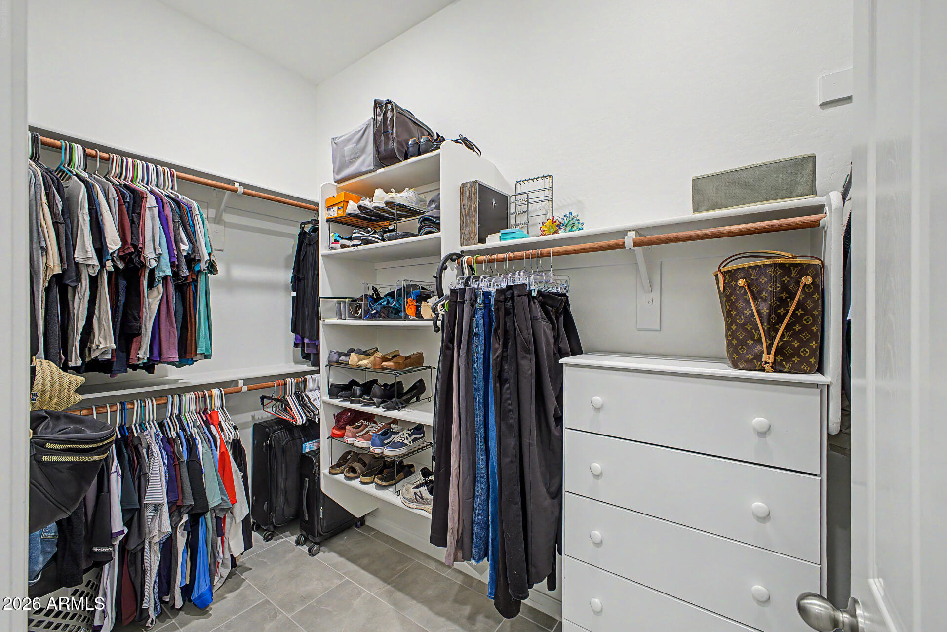 6511 West Steed Ridge Phoenix, AZ 85083 - Photo 18 of 41 a view of walk in closet with clothes and shoes