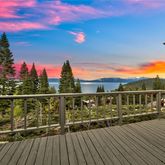 a view of balcony with wooden floor and seating space