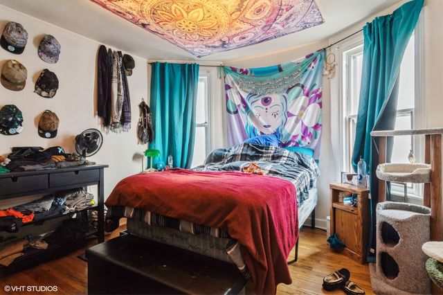 a bedroom with a bed and a window