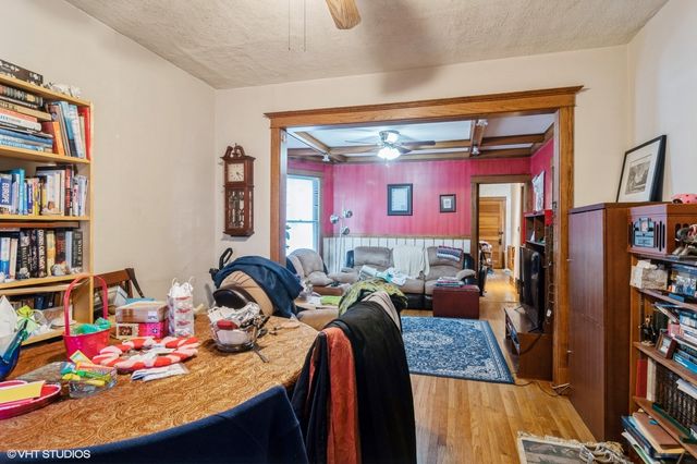 a bedroom with furniture and a book shelf