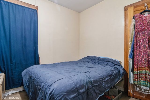 a bedroom with a bed and a closet