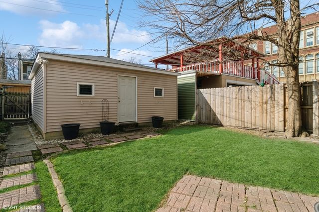 a view of backyard with a garden and plants