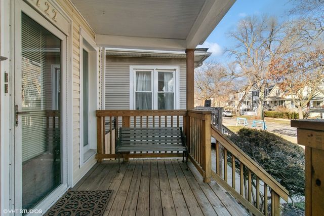 a view of a balcony with wooden floor