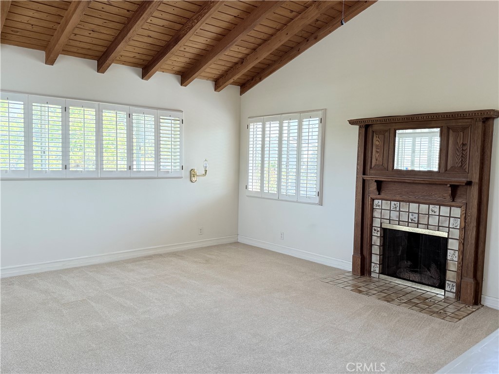 11682 Harrisburg Road Los Alamitos, CA 90720 - Photo 15 of 23 an empty room with windows and fireplace