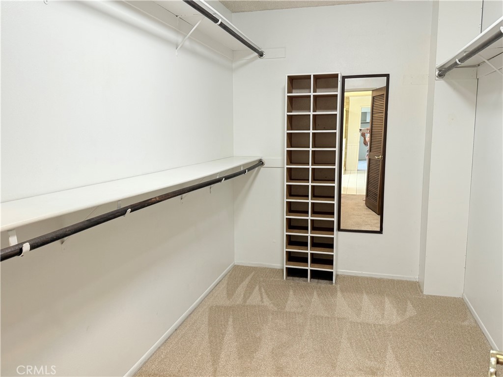 11682 Harrisburg Road Los Alamitos, CA 90720 - Photo 19 of 23 a view of walk in closet with empty racks