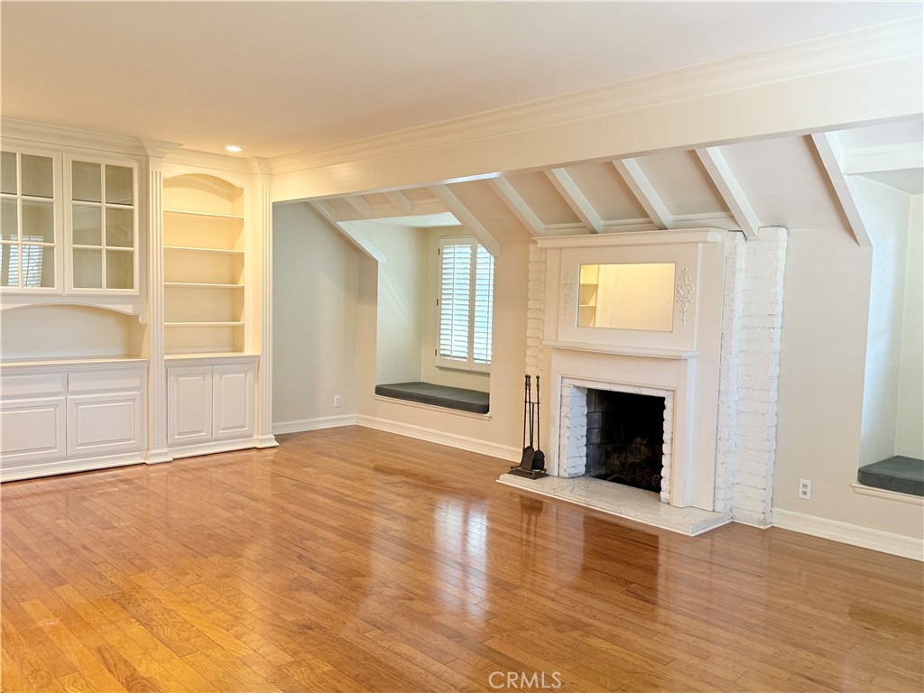 11682 Harrisburg Road Los Alamitos, CA 90720 - Photo 3 of 23 a view of an empty room with wooden floor and a window