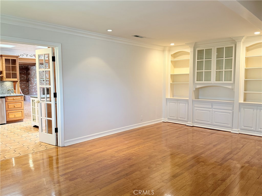 11682 Harrisburg Road Los Alamitos, CA 90720 - Photo 5 of 23 an empty room with windows and pillars in it