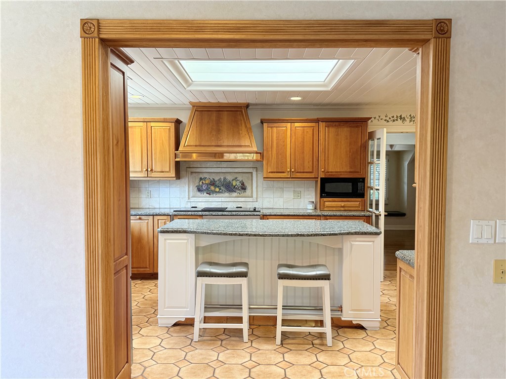 11682 Harrisburg Road Los Alamitos, CA 90720 - Photo 7 of 23 a kitchen with stainless steel appliances a sink and cabinets