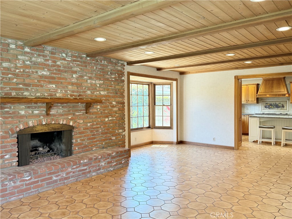 11682 Harrisburg Road Los Alamitos, CA 90720 - Photo 10 of 23 a view of an empty room with a fireplace