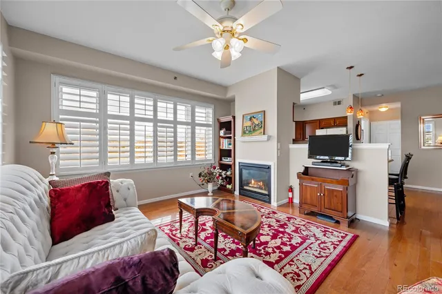 a living room with furniture fireplace and a flat screen tv