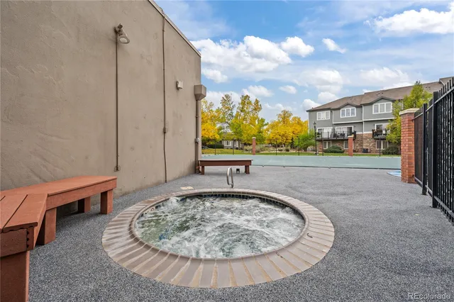 a view of a porch with a table and chairs