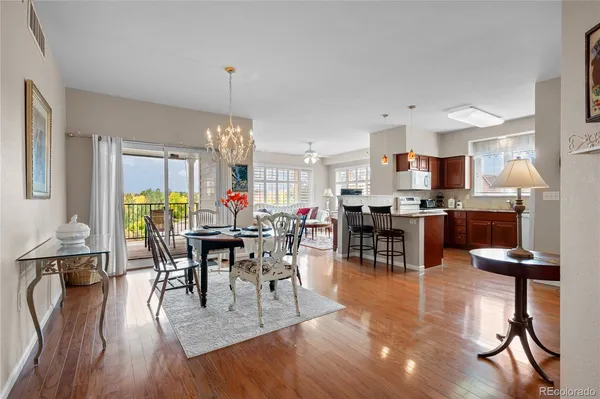 a view of a dining room with furniture window and wooden floor