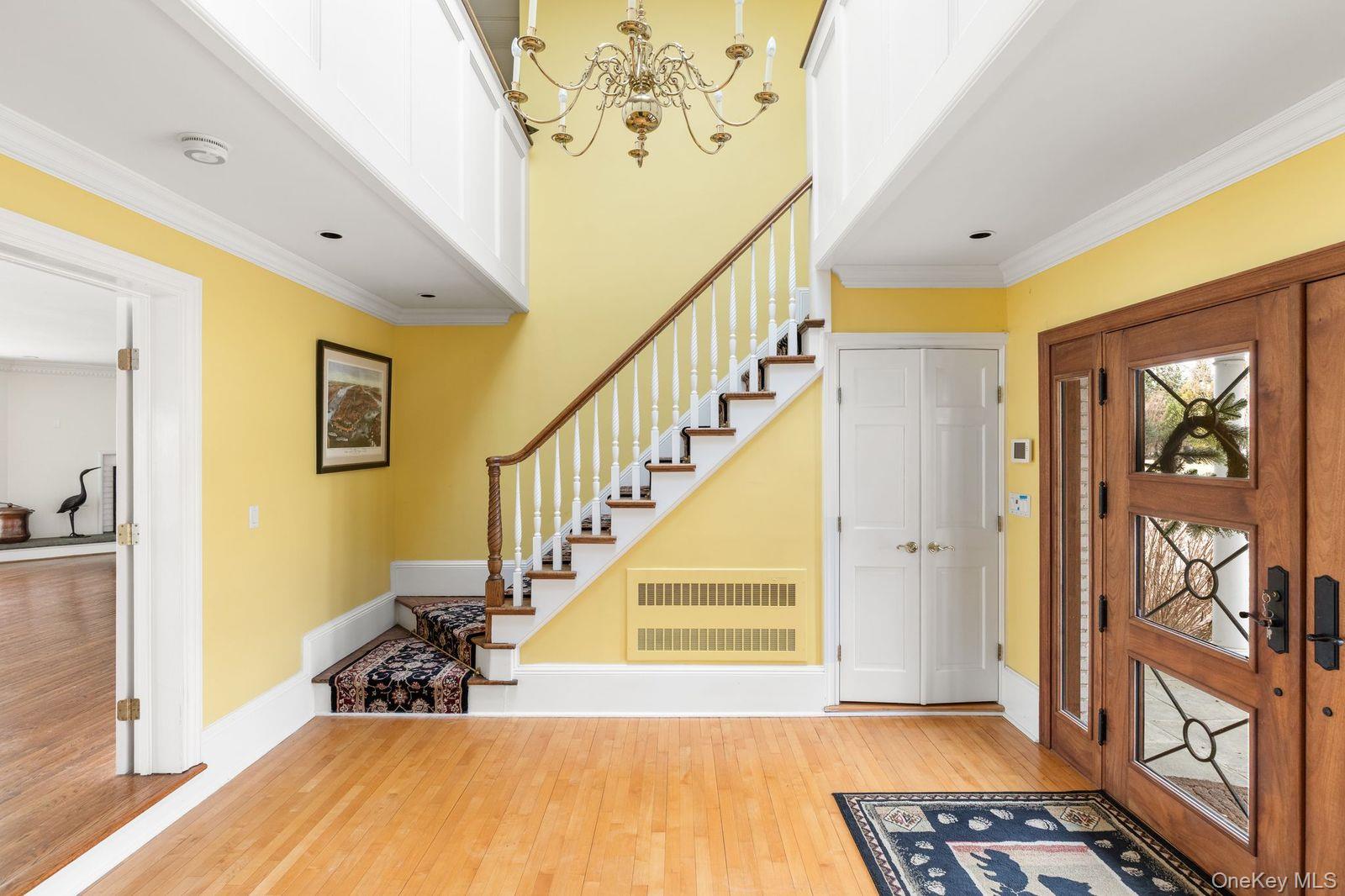 33 Beach Road Northport, NY 11768 - Photo 6 of 50 a view of a hallway with wooden floor and entryway