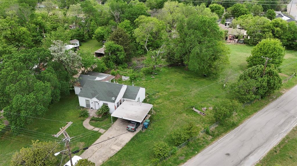 243 Walnut Street Wilmer, TX 75172 - Photo 12 of 20 an aerial view of a house with swimming pool and garden