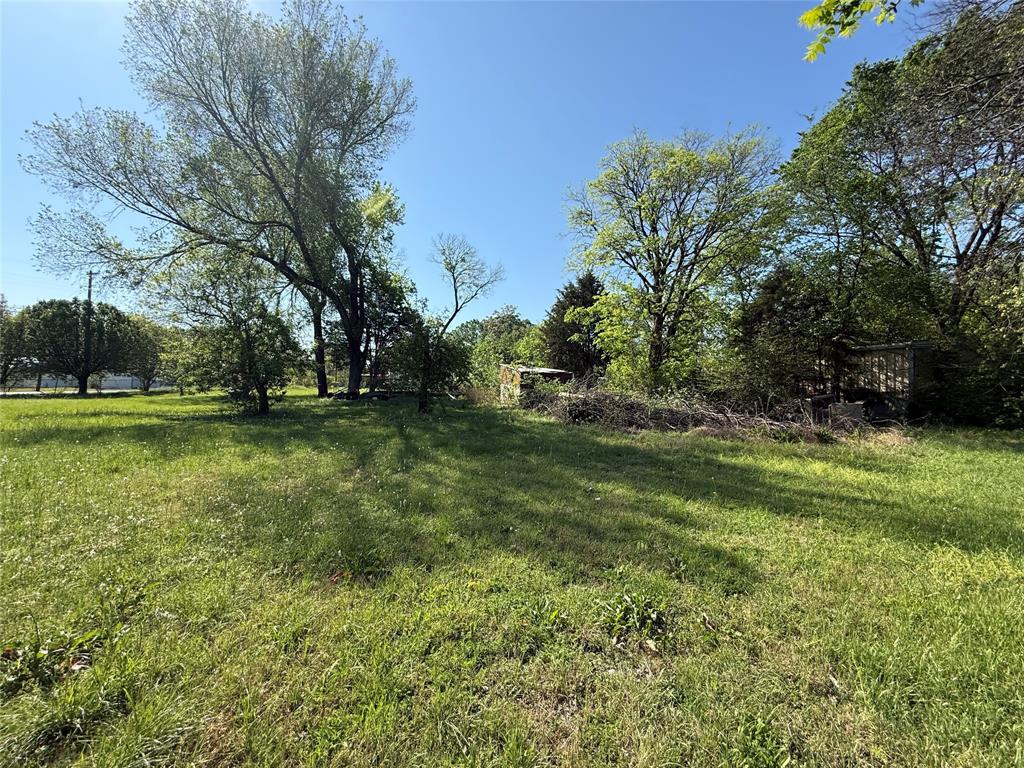 243 Walnut Street Wilmer, TX 75172 - Photo 17 of 20 a view of outdoor space with deck and yard