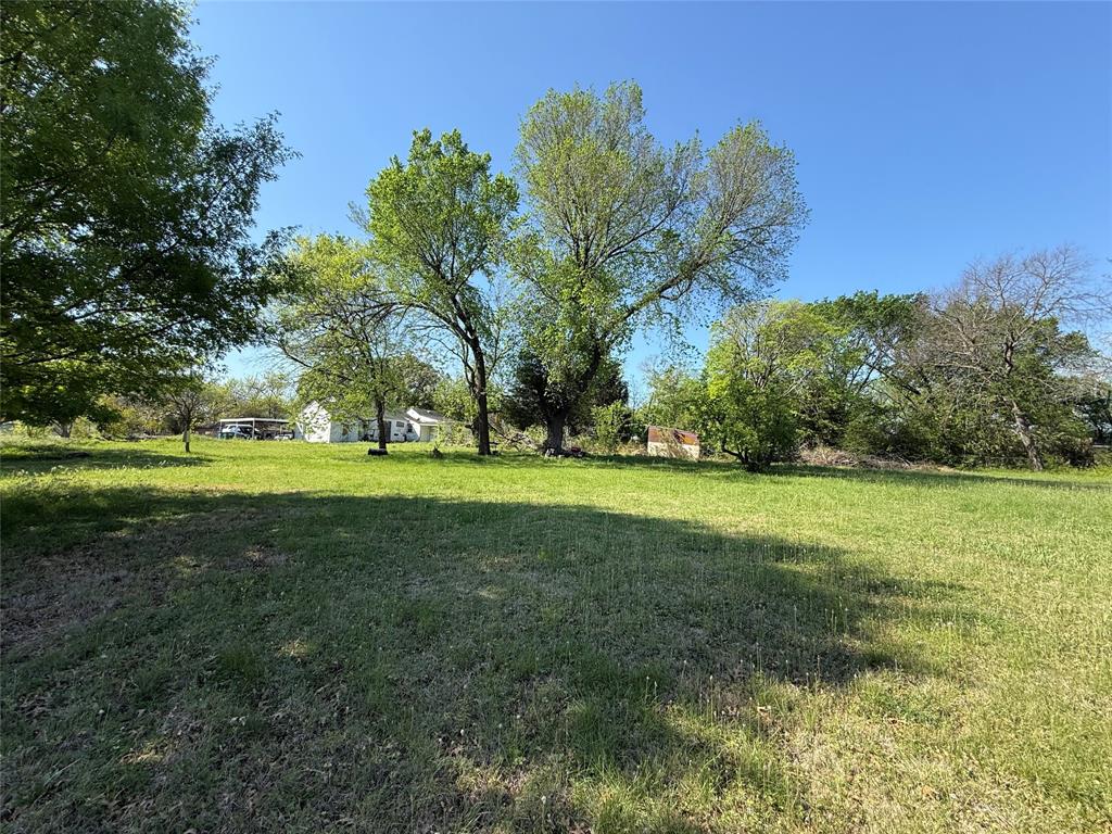 243 Walnut Street Wilmer, TX 75172 - Photo 20 of 20 a huge green field with lots of trees