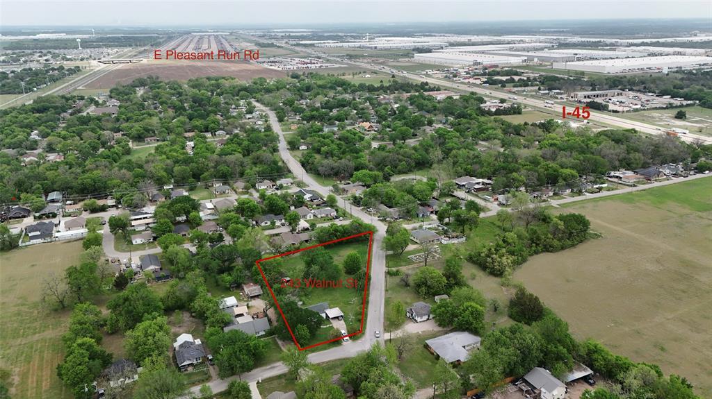 243 Walnut Street Wilmer, TX 75172 - Photo 4 of 20 an aerial view of a city with lots of residential buildings