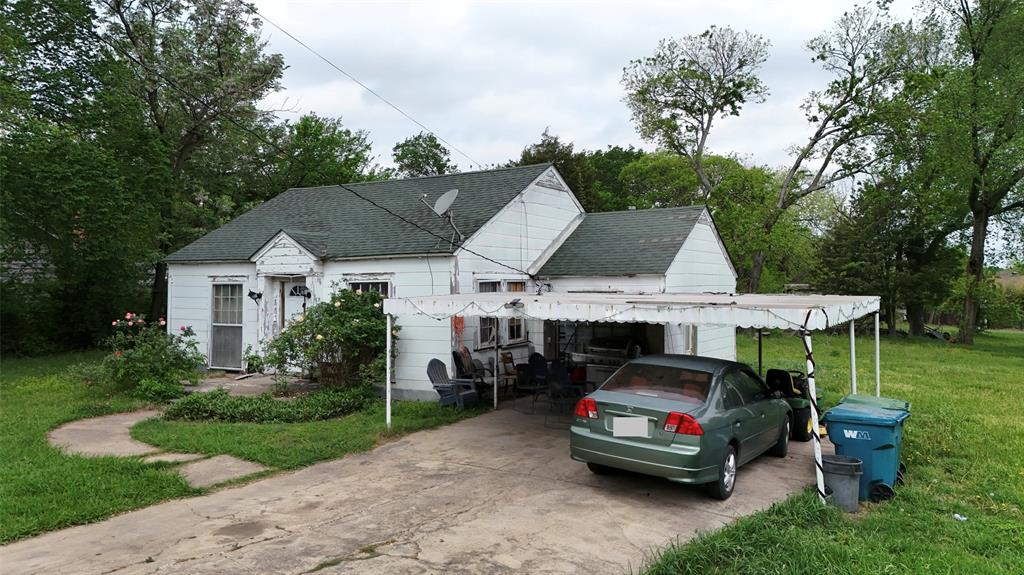 243 Walnut Street Wilmer, TX 75172 - Photo 7 of 20 a car parked in front of a house