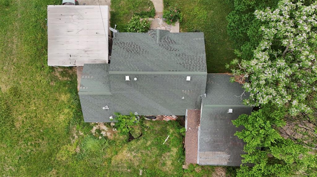 243 Walnut Street Wilmer, TX 75172 - Photo 10 of 20 an aerial view of a house having yard