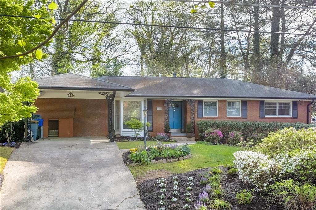 a front view of a house with garden