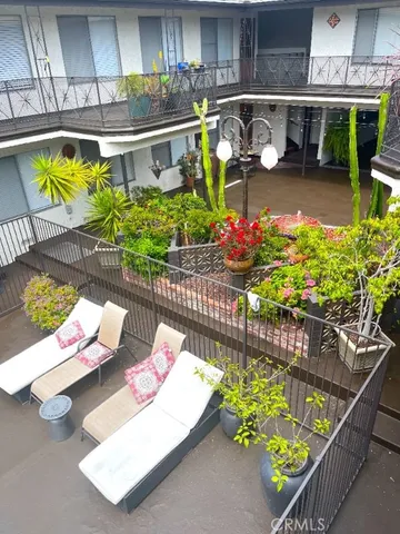 a view of a chairs and table in a patio