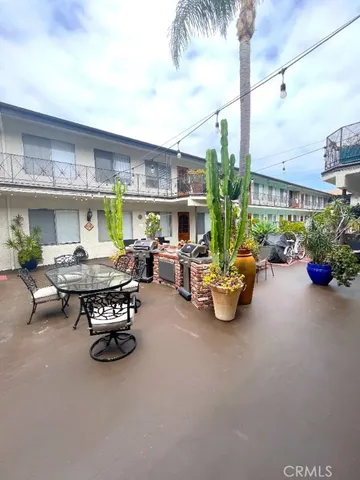 a terrace with a table and chairs