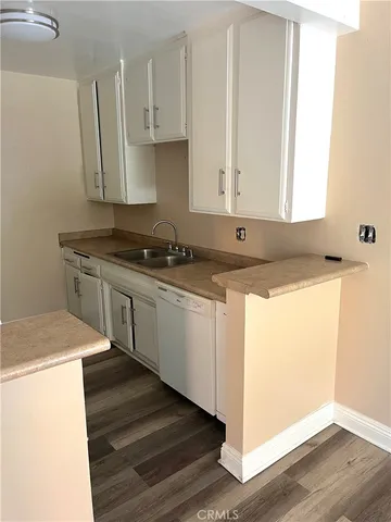 a kitchen with a stove and a refrigerator