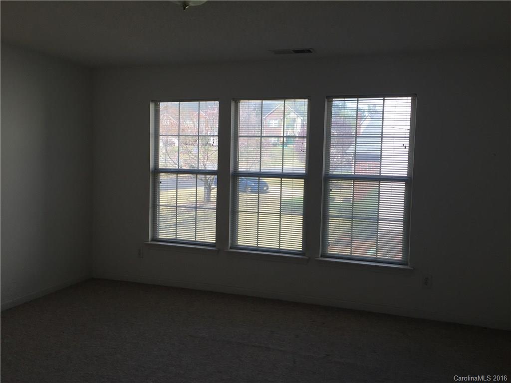12232 Old Timber Road Charlotte, NC 28269 - Photo 11 of 15 a view of an empty room with a window