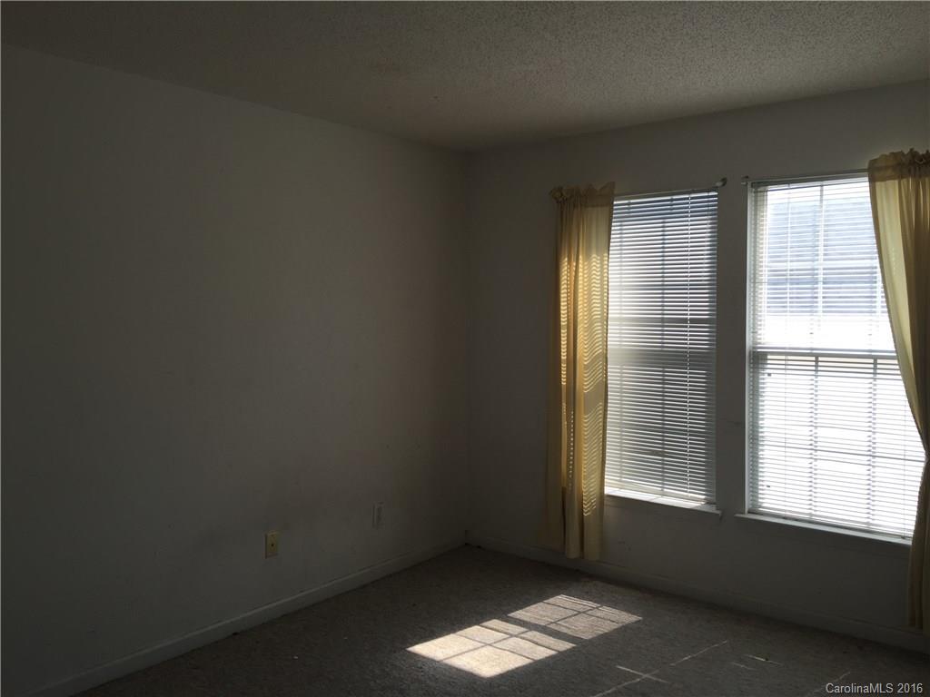 12232 Old Timber Road Charlotte, NC 28269 - Photo 13 of 15 an empty room with a window
